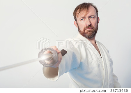 A man with katana on Iaido practice A man with katana on Iaido practice 28715486