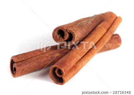 three cinnamon sticks isolated on white background 28716348
