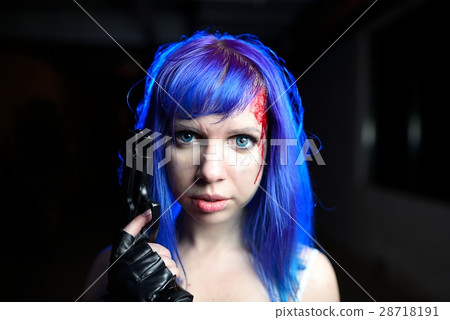 Portrait of sexy woman with blue hair holding gun and looking as killer Portrait of sexy woman with blue hair holding gun and looking as killer 28718191