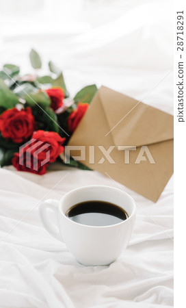 cup of coffee and a bouquet of red roses, envelope cup of coffee and a bouquet of red roses, envelope 28718291