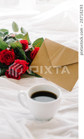 cup of coffee and a bouquet of red roses, envelope cup of coffee and a bouquet of red roses, envelope 28718293
