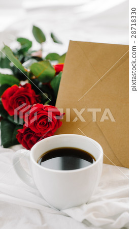 cup of coffee and a bouquet of red roses, envelope cup of coffee and a bouquet of red roses, envelope 28718330