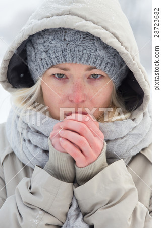 Portrait of lady outdoor in snow in cold winter 28723682
