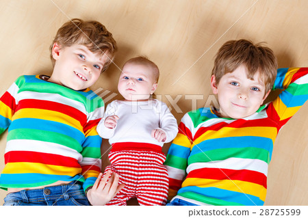 Two happy little preschool kids boys with newborn Two happy little preschool kids boys with newborn 28725599