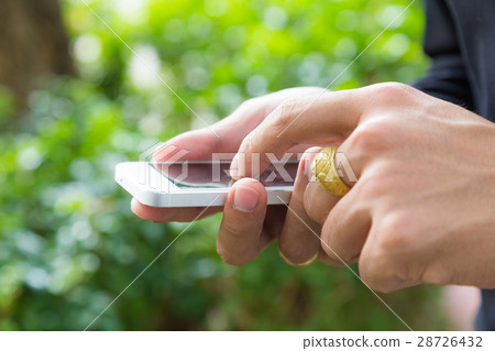Business rich man touch on mobile phone in hand Business rich man touch on mobile phone in hand 28726432
