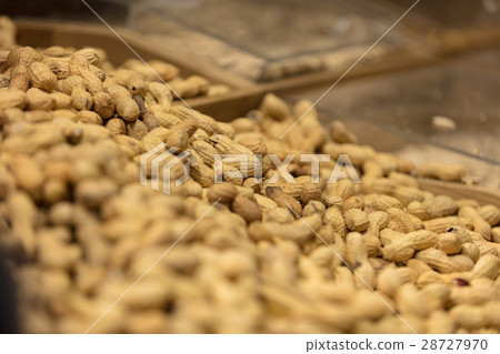 A bunch of Peanut shells in grocery store. 28727970