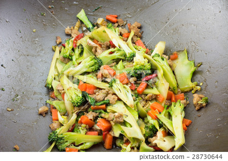 Fried pork with block Kerry and carrots. t Fried pork with block Kerry and carrots. t 28730644