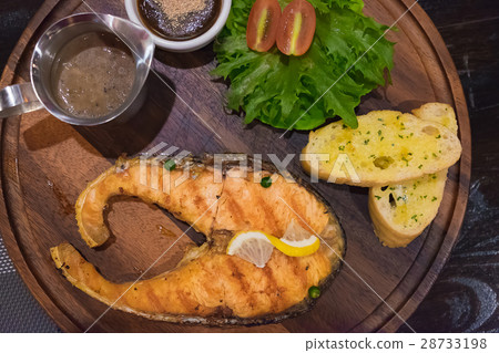 Grilled salmon steak with the fresh salad Grilled salmon steak with the fresh salad 28733198