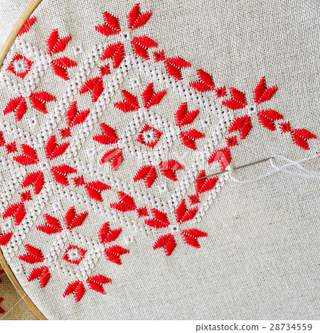 Handmade embroidery by red and white threads. Handmade embroidery by red and white threads. 28734559