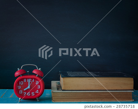Blackboard, books and watches. 28735718