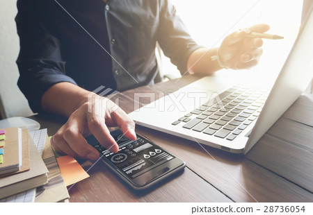businessman hand working laptop on wooden desk 28736054