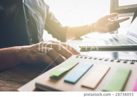 businessman hand working laptop on wooden desk 28736055
