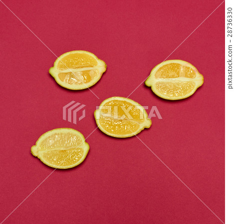 Lemons on red background Lemons on red background 28736330