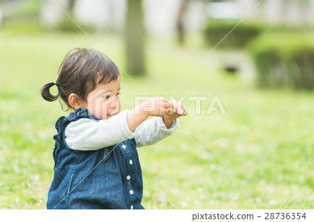 Infant Spring Playing in Green Spring 28736354