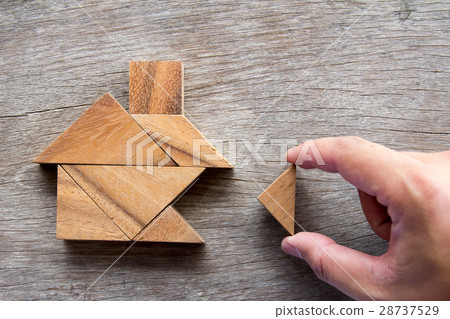 Wooden tangram puzzle wait to fulfill home shape 28737529