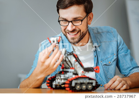 Positive engineeer working in a lab 28737967