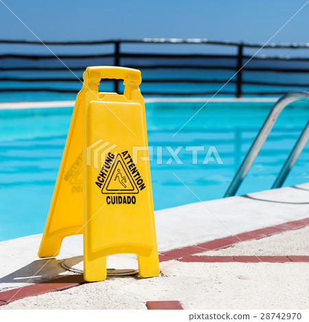 图库照片: slippery floor surface attention symbol