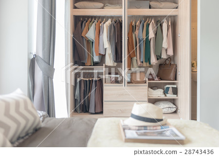 colorful clothes hanging on rail 28743436