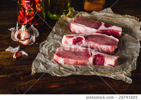Raw Pork Loin Steaks with Spices. 28743885