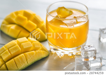 Mango juice on the wooden table Mango juice on the wooden table 28744259