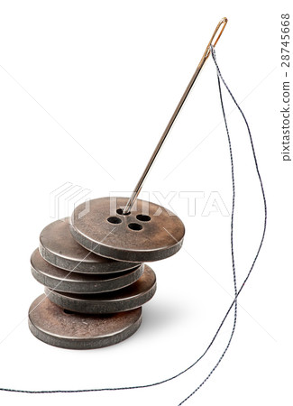 Stack of old buttons and needle with thread Stack of old buttons and needle with thread 28745668
