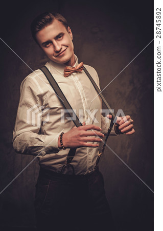 Sharp dressed man wearing suspenders and bow tie Sharp dressed man wearing suspenders and bow tie 28745892