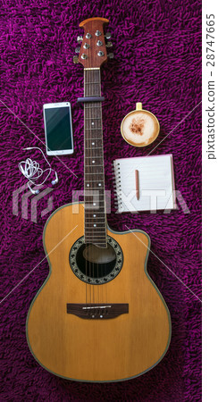 acoustic guitar,smartphone,cup of coffee,notebook 28747665