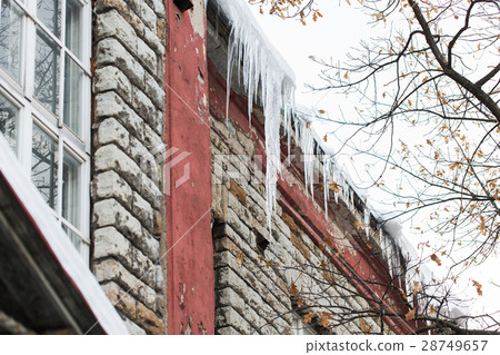 icicles on building or living house facade icicles on building or living house facade 28749657