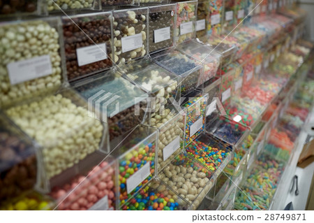 different sweets in boxes at candy shop 28749871