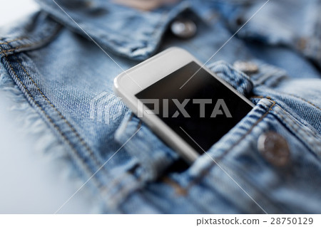 smartphone in pocket of denim jacket or waistcoat smartphone in pocket of denim jacket or waistcoat 28750129