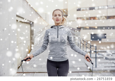 woman exercising with jump-rope outdoors woman exercising with jump-rope outdoors 28751859