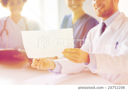 close up of doctors with cardiogram at hospital close up of doctors with cardiogram at hospital 28752206