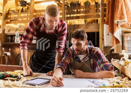workmen with tablet pc and blueprint at workshop workmen with tablet pc and blueprint at workshop 28752269