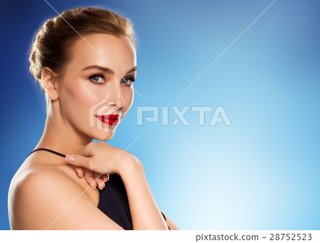 beautiful woman in black over blue background 28752523