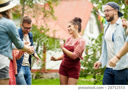 happy friends dancing at summer party in garden happy friends dancing at summer party in garden 28752553