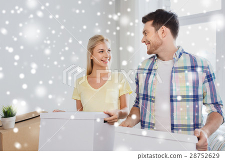 smiling couple with big boxes moving to new home smiling couple with big boxes moving to new home 28752629