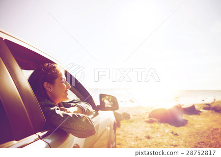 happy teenage girl or young woman in car happy teenage girl or young woman in car 28752817