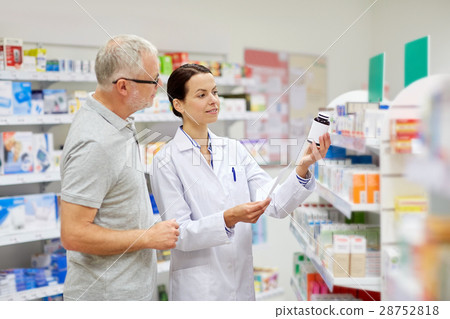 pharmacist and senior man buying drug at pharmacy pharmacist and senior man buying drug at pharmacy 28752818
