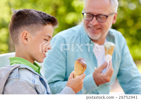 old man and boy eating ice cream at summer park 28752941