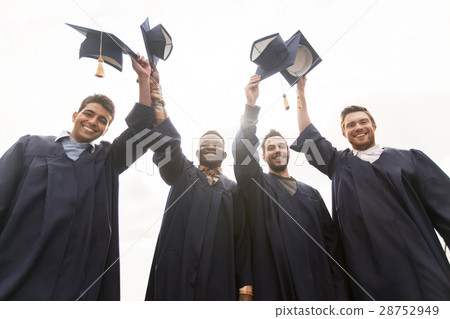 happy students or bachelors waving mortar boards 28752949