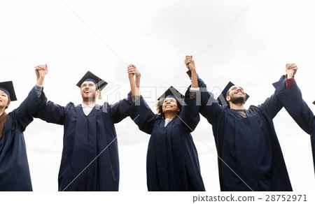 happy students or bachelors celebrating graduation 28752971