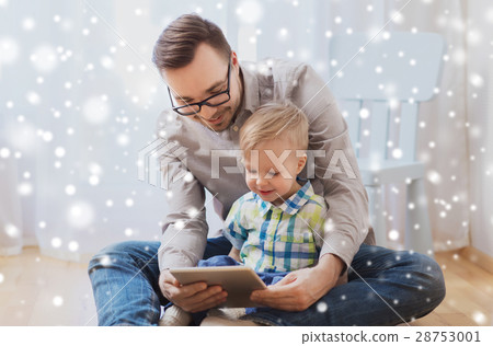 father and son with tablet pc playing at home father and son with tablet pc playing at home 28753001