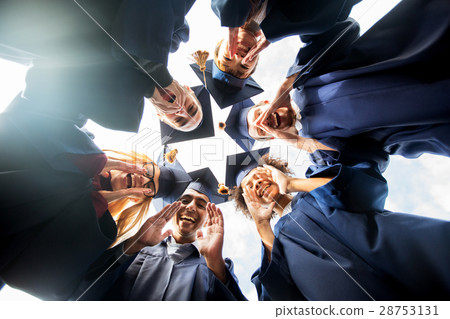 happy students or bachelors in mortar boards 28753131