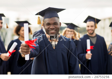 happy students in mortar boards with diplomas happy students in mortar boards with diplomas 28753256