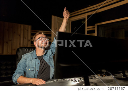 man at mixing console in music recording studio man at mixing console in music recording studio 28753367
