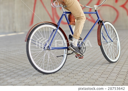 close up of hipster man riding fixed gear bike 28753642