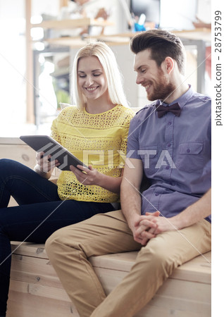 happy creative team with tablet pc in office happy creative team with tablet pc in office 28753799