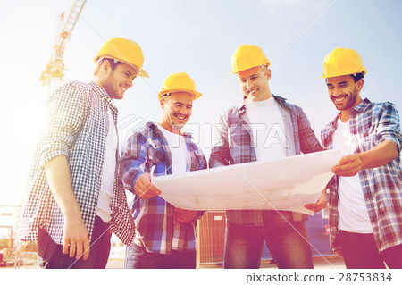 group of builders with tablet pc and blueprint group of builders with tablet pc and blueprint 28753834