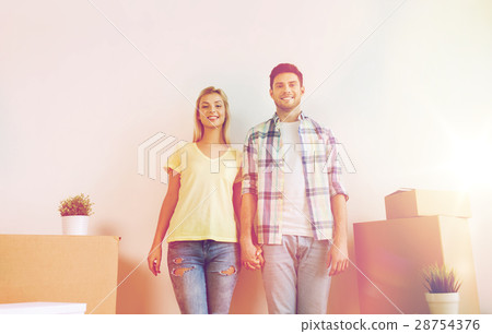 smiling couple with big boxes moving to new home 28754376