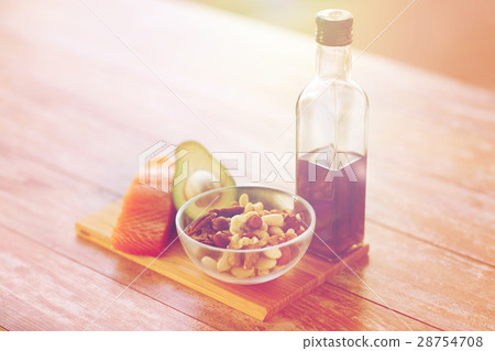close up of food and olive oil bottle on table 28754708